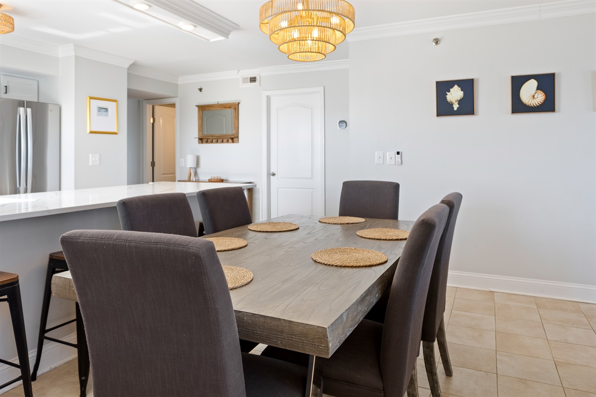 Dining room with seating for 6 and seating for 4 at the kitchen bar