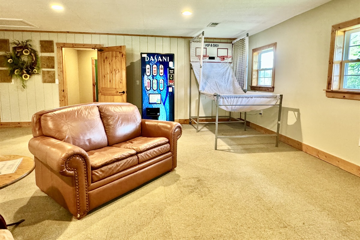 Seating area, vending machine, and basketball game in the Clubhouse!