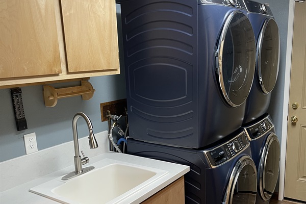 Laundry room with double washer dryer-stocked with laundry soap and dryer sheets for your convenience.  High chair/broom/ironing board can also be found in laundry room.