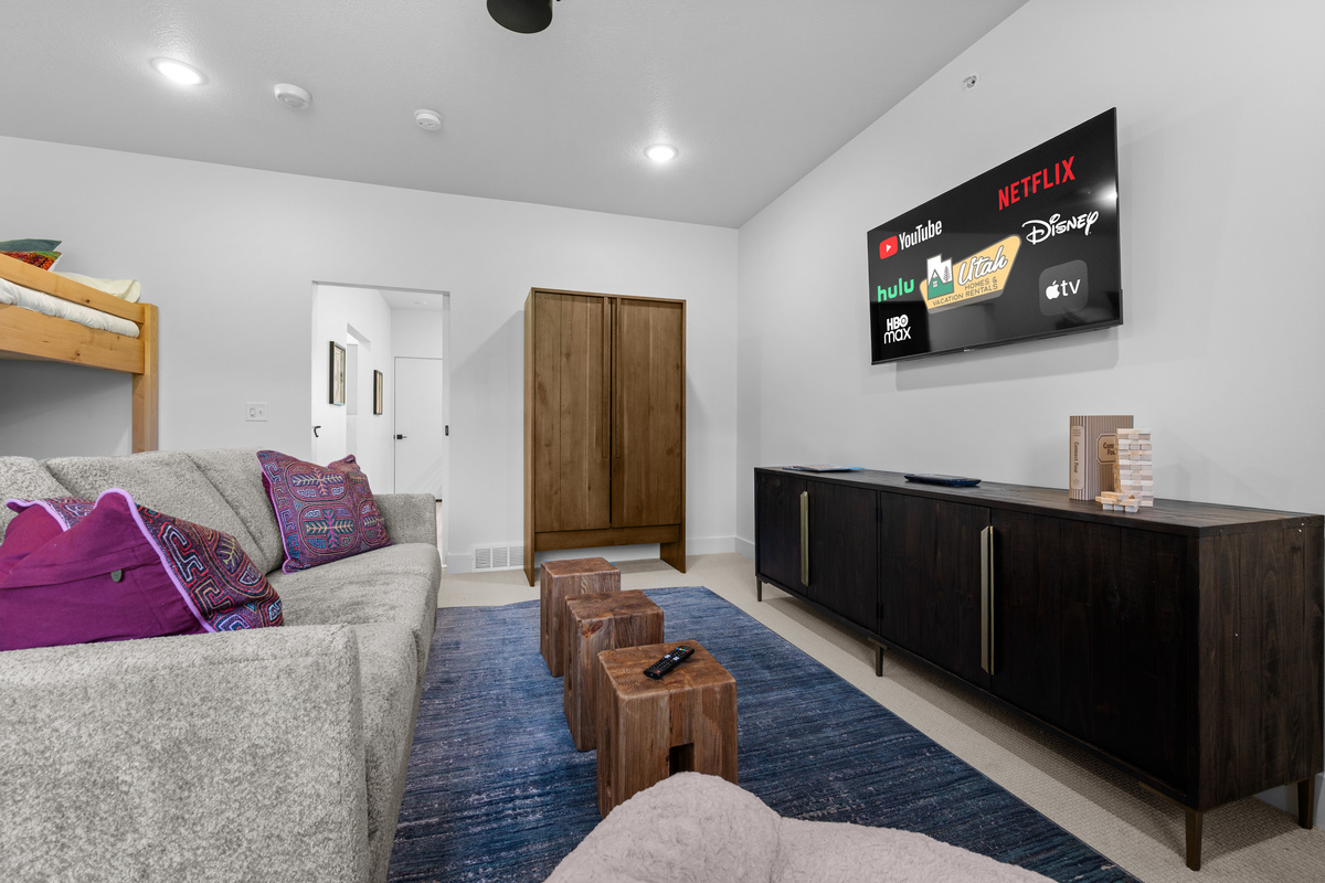 Spacious upper-level room with entertainment and mountain views.