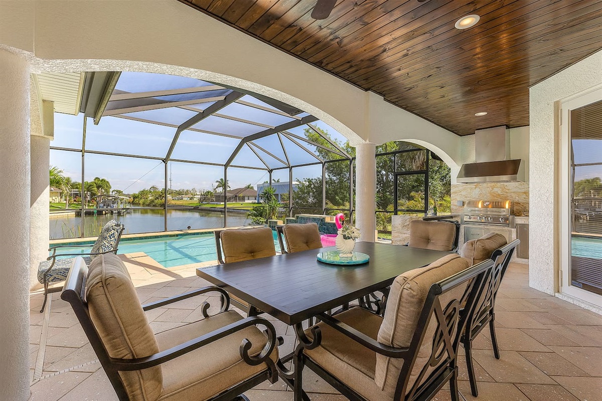 Enjoy picturesque outdoor dining with stunning views of the water and pool!
