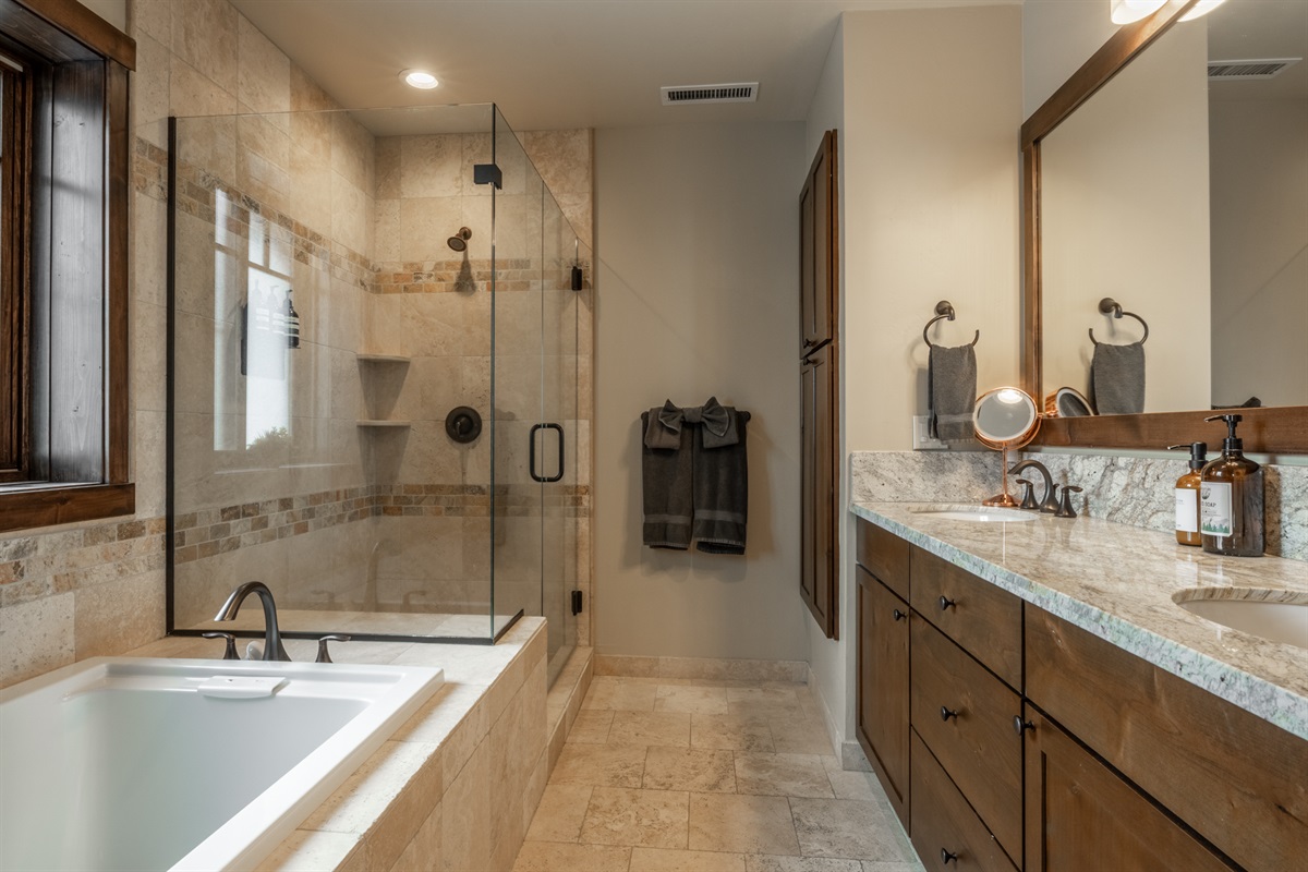 Unwind in the soaking tub or refresh in the walk-in shower, with the added convenience of a private water closet for comfort and privacy.