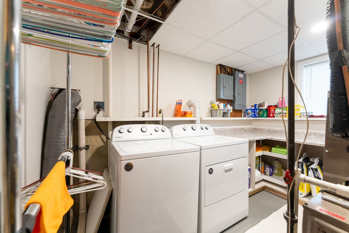 Laundry room with full sized washer & dryer. Lots of counter space!