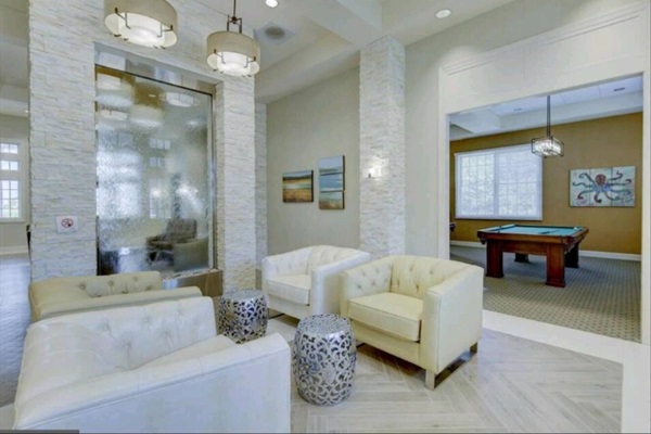 Comfortable Lounge: Sink into plush sofas against a stylish stone feature wall. Whether you’re catching up with friends or enjoying a quiet moment, this snug nook has you covered.