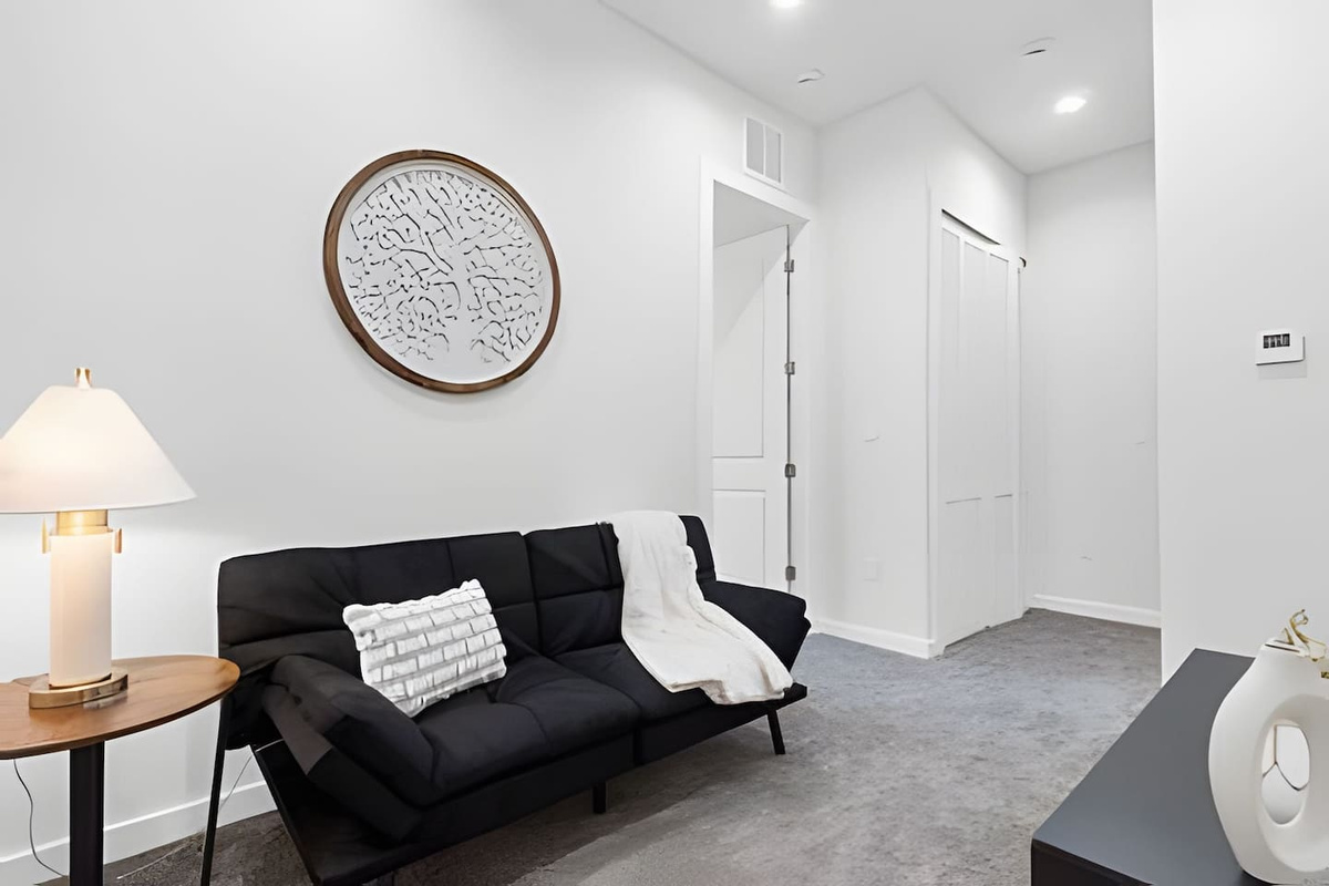 Relax in this cozy and stylish living space, complete with modern décor and a comfortable sofa.