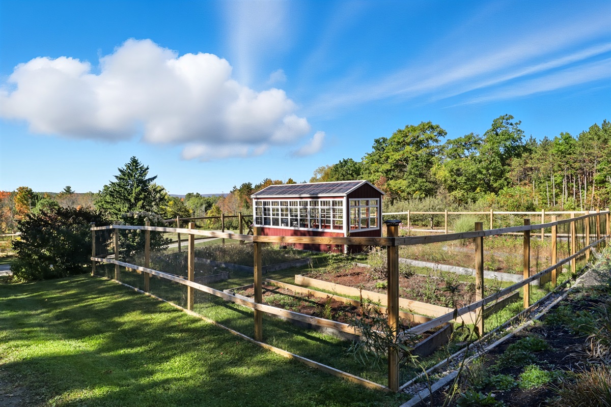 Fenced garden with stunning home backdrop.