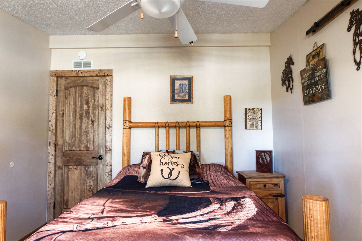 Cabin-style bedroom made for relaxation and unwinding.