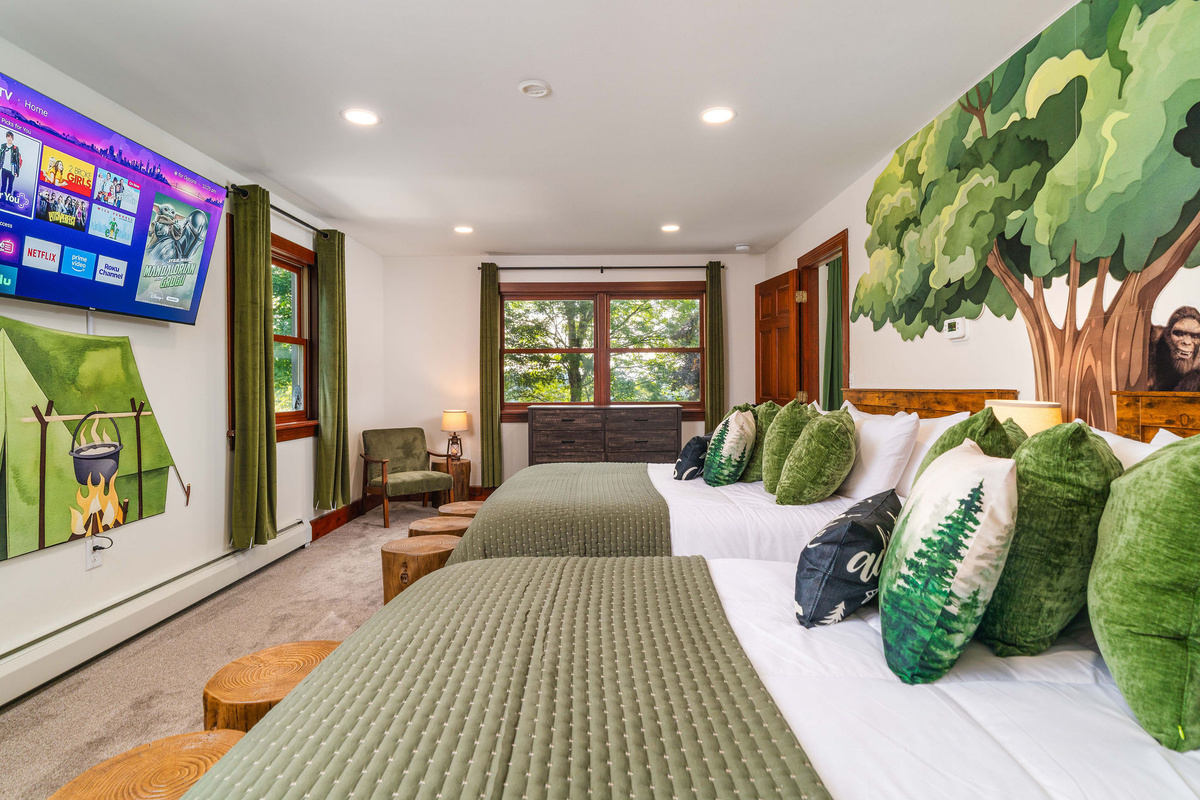 🌲 Camping Room sleeps four in two queens. Look closely at the tree — someone's hiding in it.
