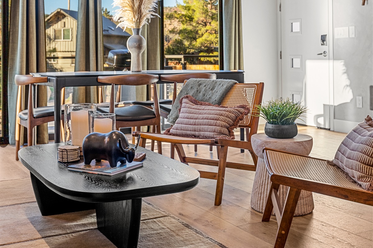 A comfortable seating area with natural light, warm textures, and thoughtful details - perfect for morning coffee, quiet moments, or unwinding at the end of the day.