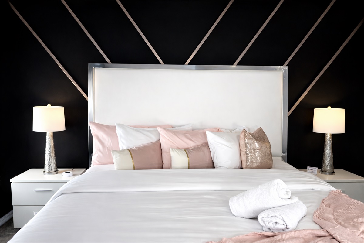 Sink into luxury — a serene master retreat with plush pillows, soft lighting, and a hotel-quality king bed designed for pure relaxation