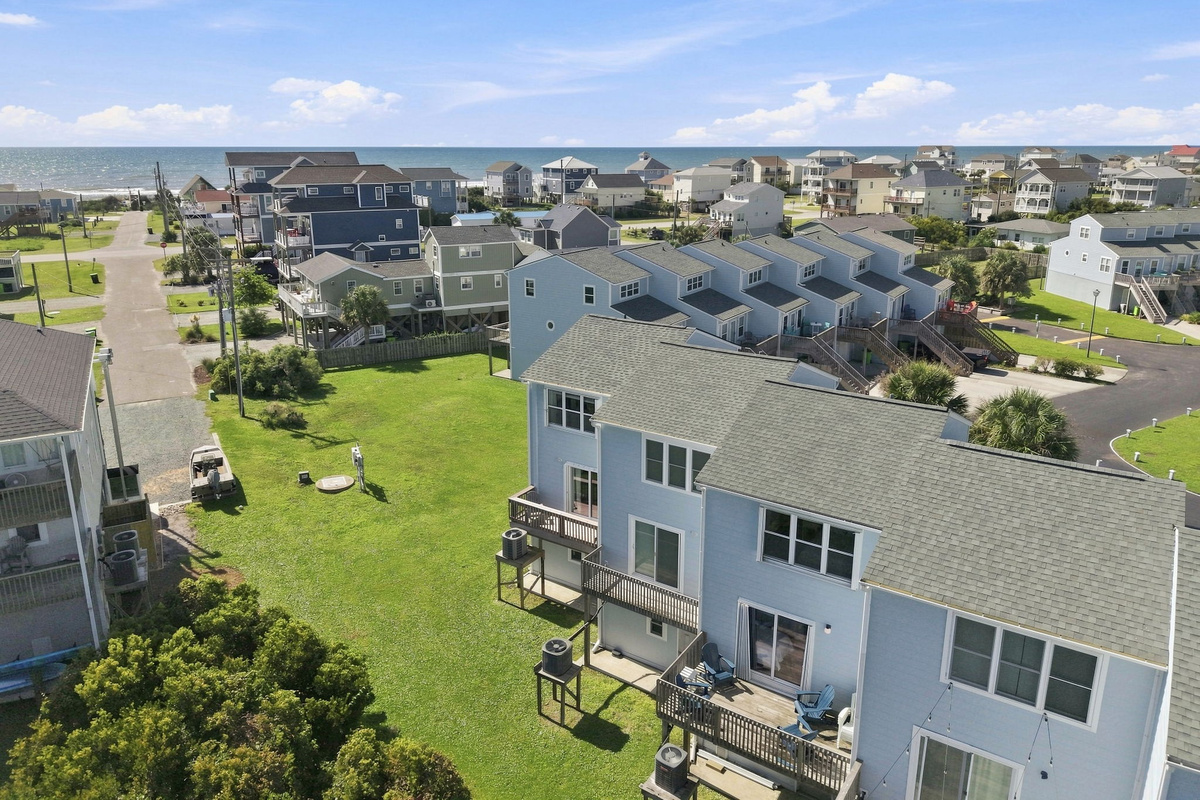 Beautiful open green spaces and classic architecture frame this inviting coastal retreat.