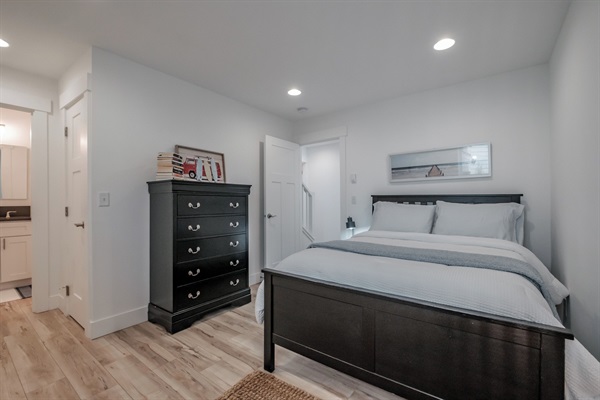 A generously sized lower-level bedroom offering privacy and comfort for multi-family stays. 