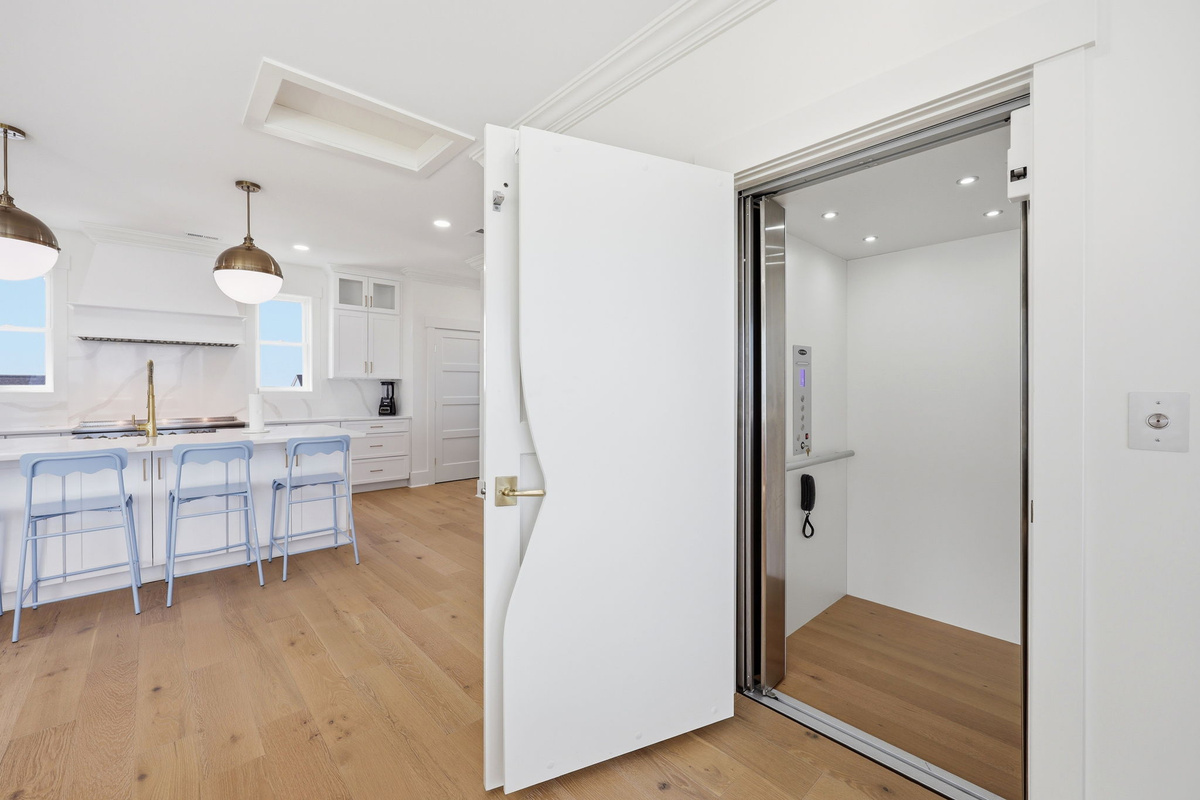 Private hallway with elevator access and high-end stainless appliances for added convenience