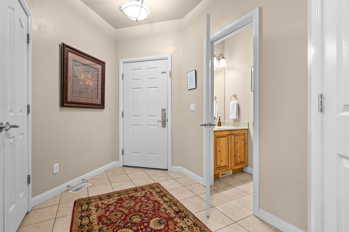 Welcoming entryway and half bath.