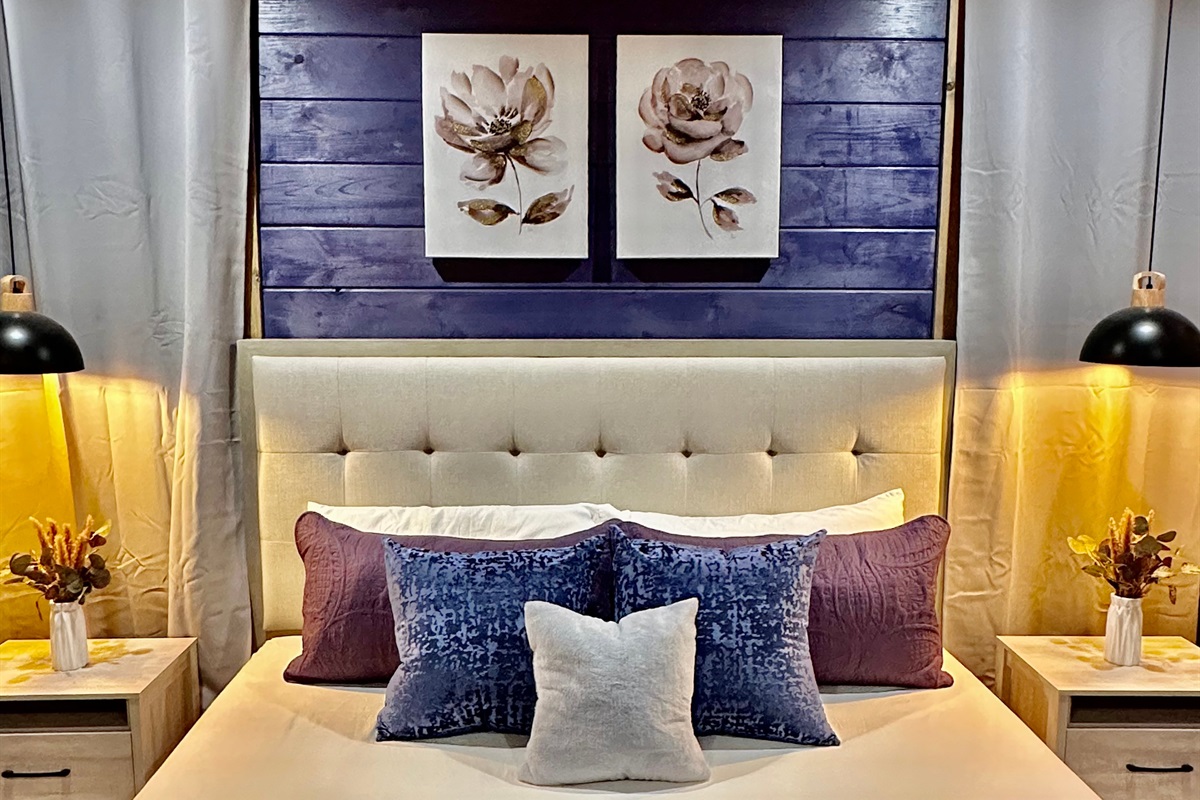 Soft layers, warm lighting, and thoughtful details create a cozy king retreat made for unwinding. Tucked in with plush pillows and calming tones, this space invites slow nights and easy mornings in the mountains.