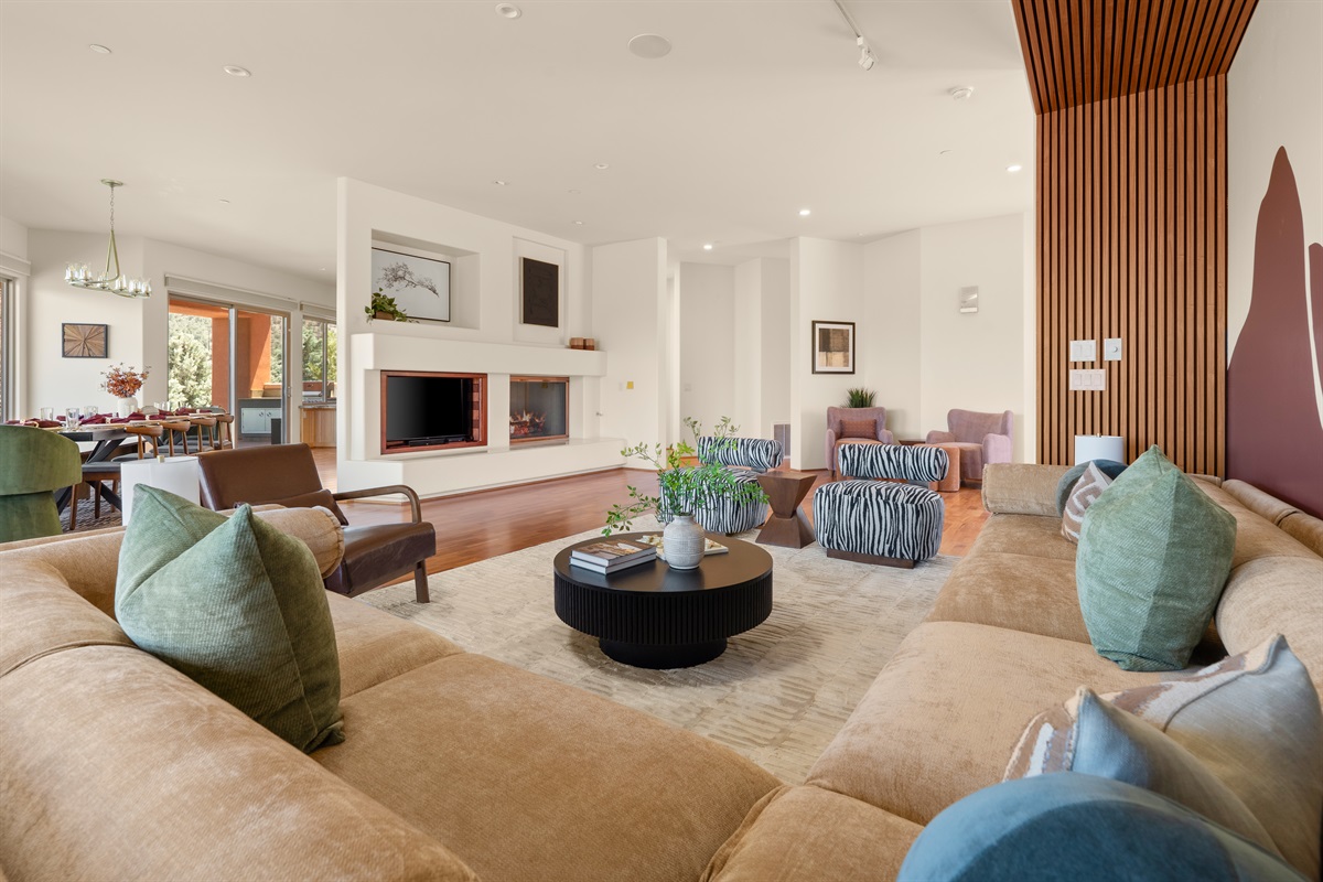 Designed for large groups. With a 4+ bedroom layout, our open-concept living room provides more than enough space for the whole family to gather comfortably around the modern fireplace.