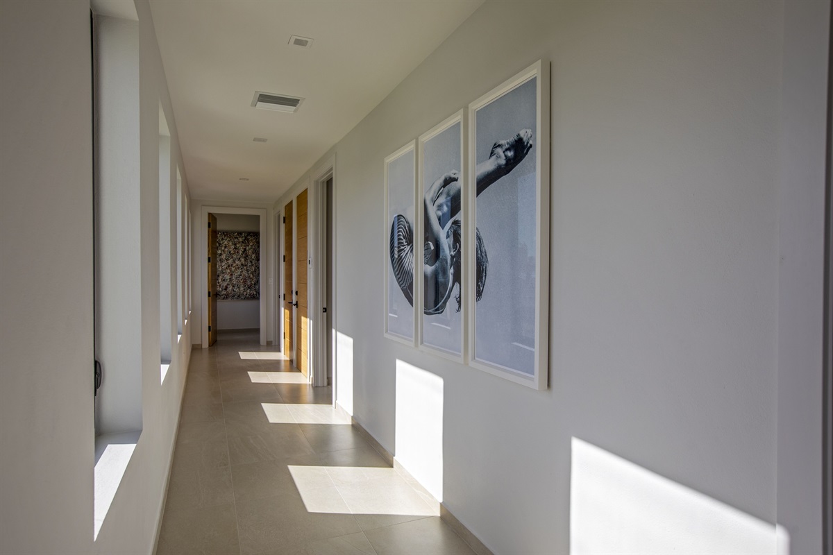 Hallway with 2 king bedrooms leading to second master bedroom