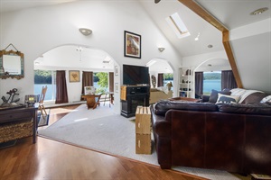 House living room with leather couches and tv