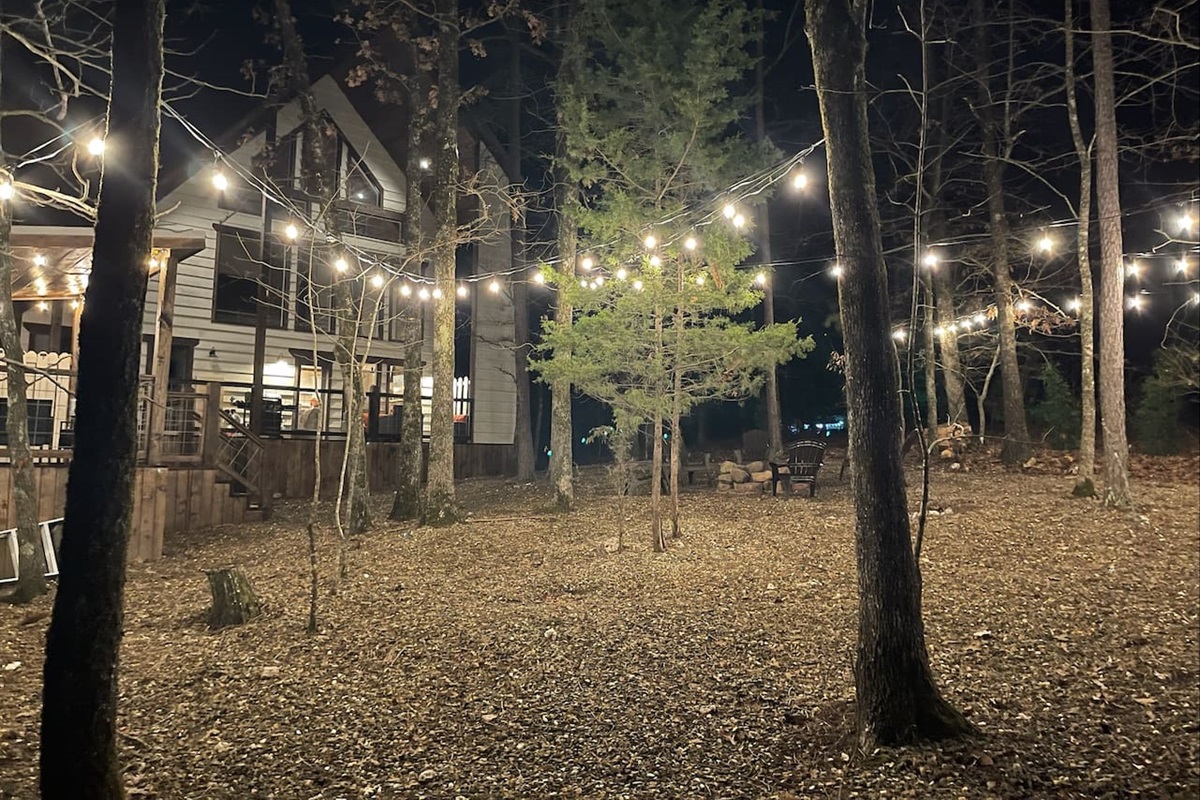 @vanillabeancabin overhead party lights, lighting up the Ouachita National Forest for a relaxing and peaceful setting!