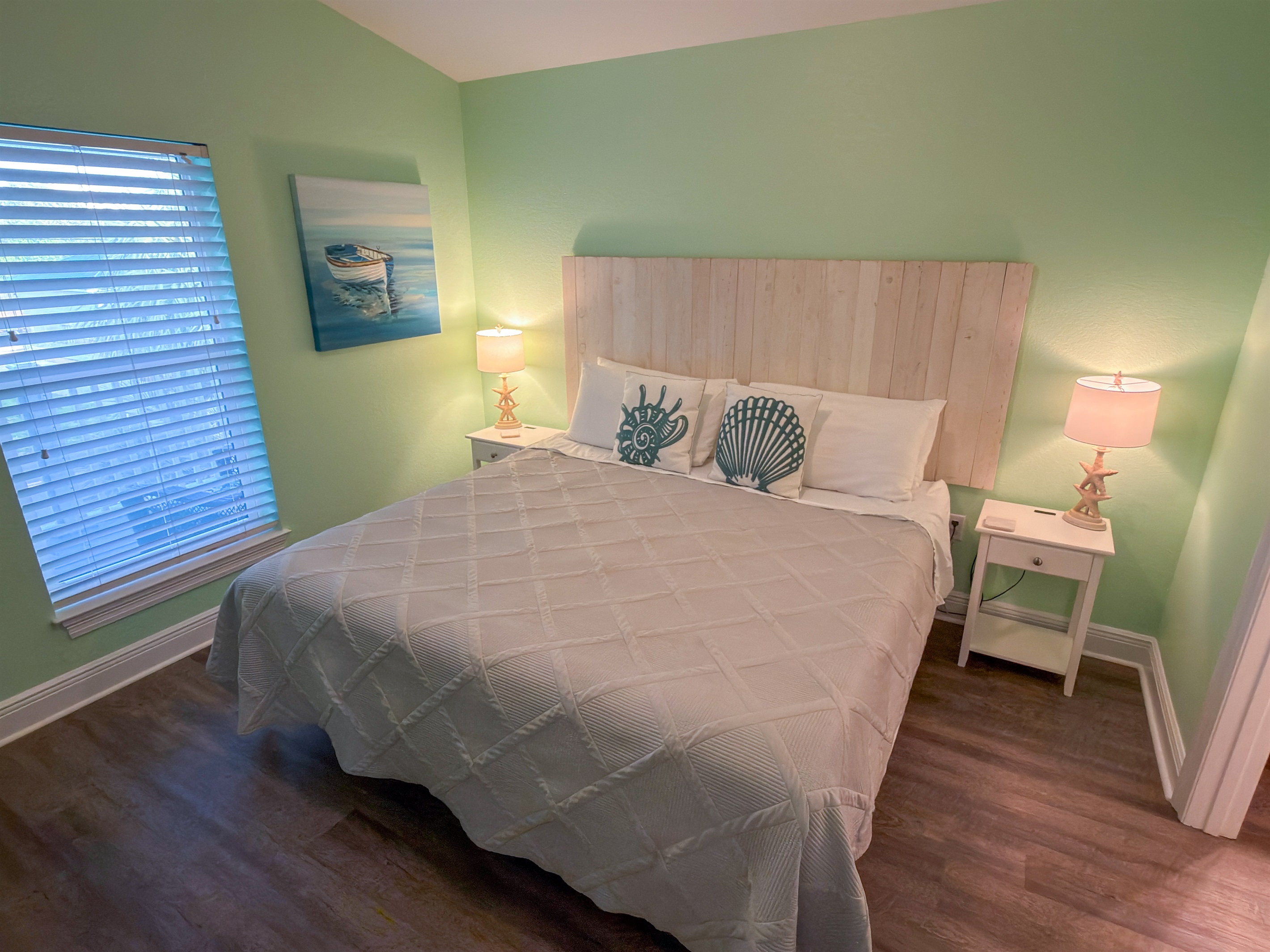 Second Floor Bedroom 6 captures the feeling of a quiet beach cottage with plush textures, coastal décor, and warm seaside character throughout.