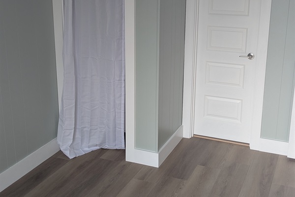 Bedroom also has a small closet for hanging clothes and storing items.