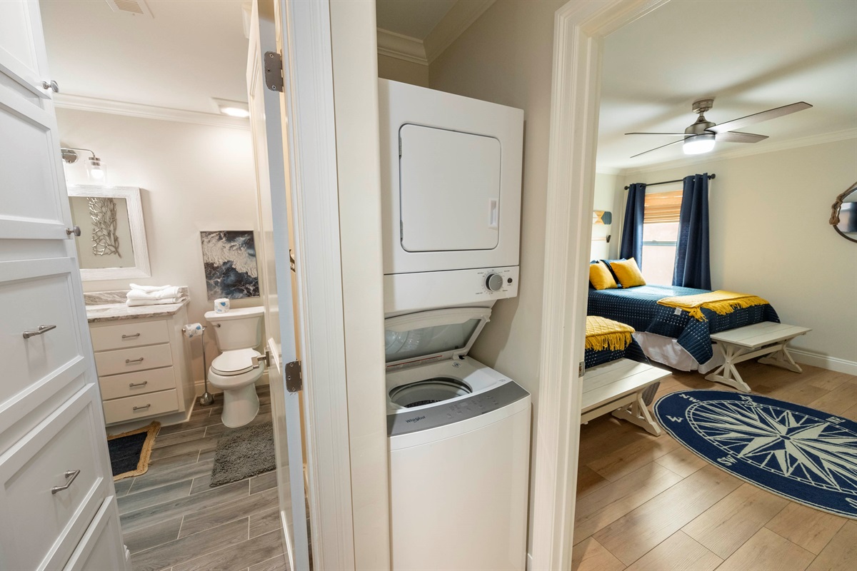Comfort and convenience! This space features a washer-dryer, a cozy bedroom, and a stylish bathroom.