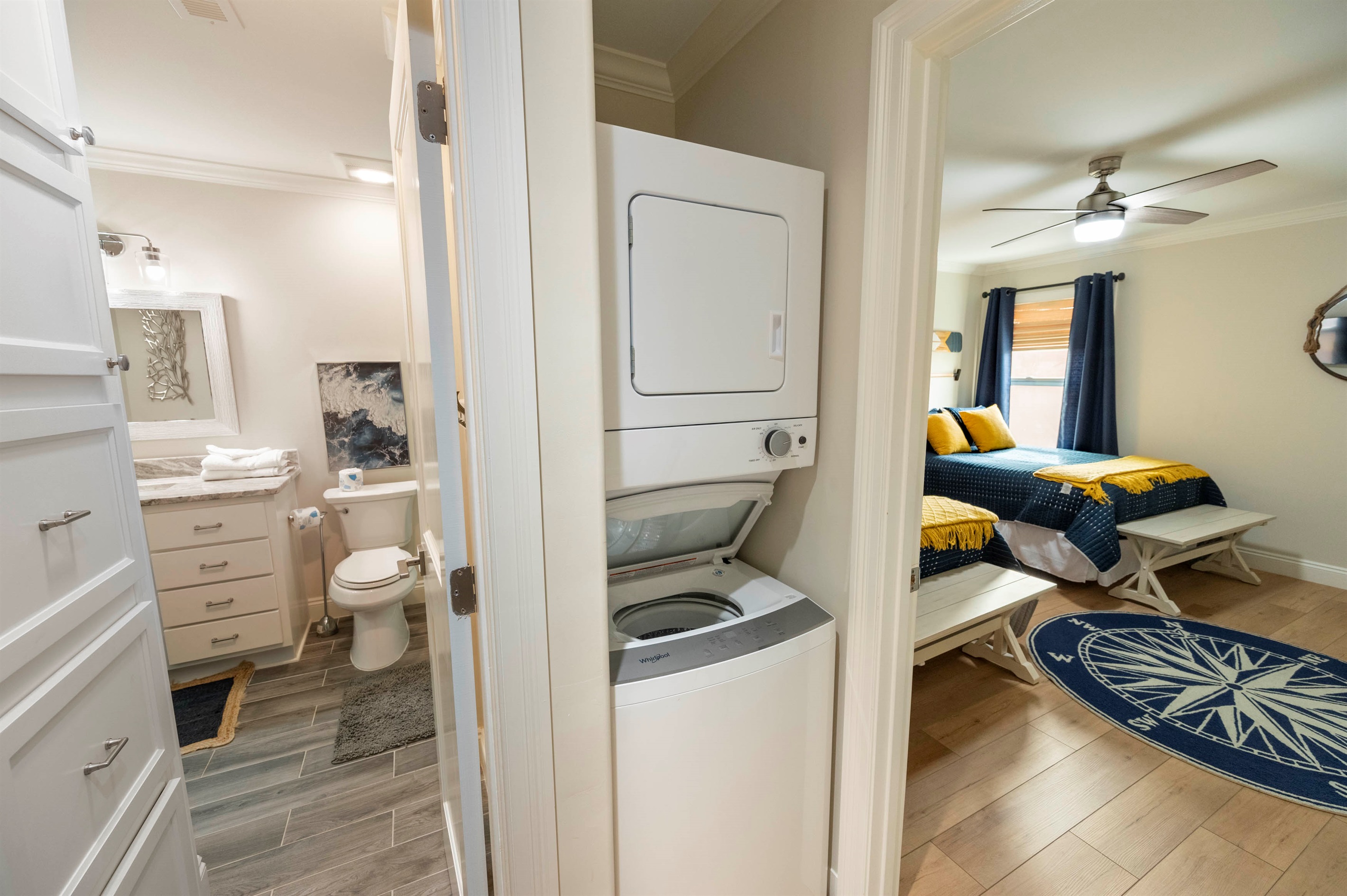 Comfort and convenience! This space features a washer-dryer, a cozy bedroom, and a stylish bathroom.
