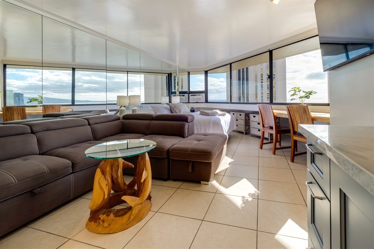 Experience Waikīkī from above — where ocean horizons meet modern island comfort. This bright, contemporary suite offers sweeping views, stylish furnishings, and a serene space to unwind after exploring Honolulu’s beaches, dining, and nightlife