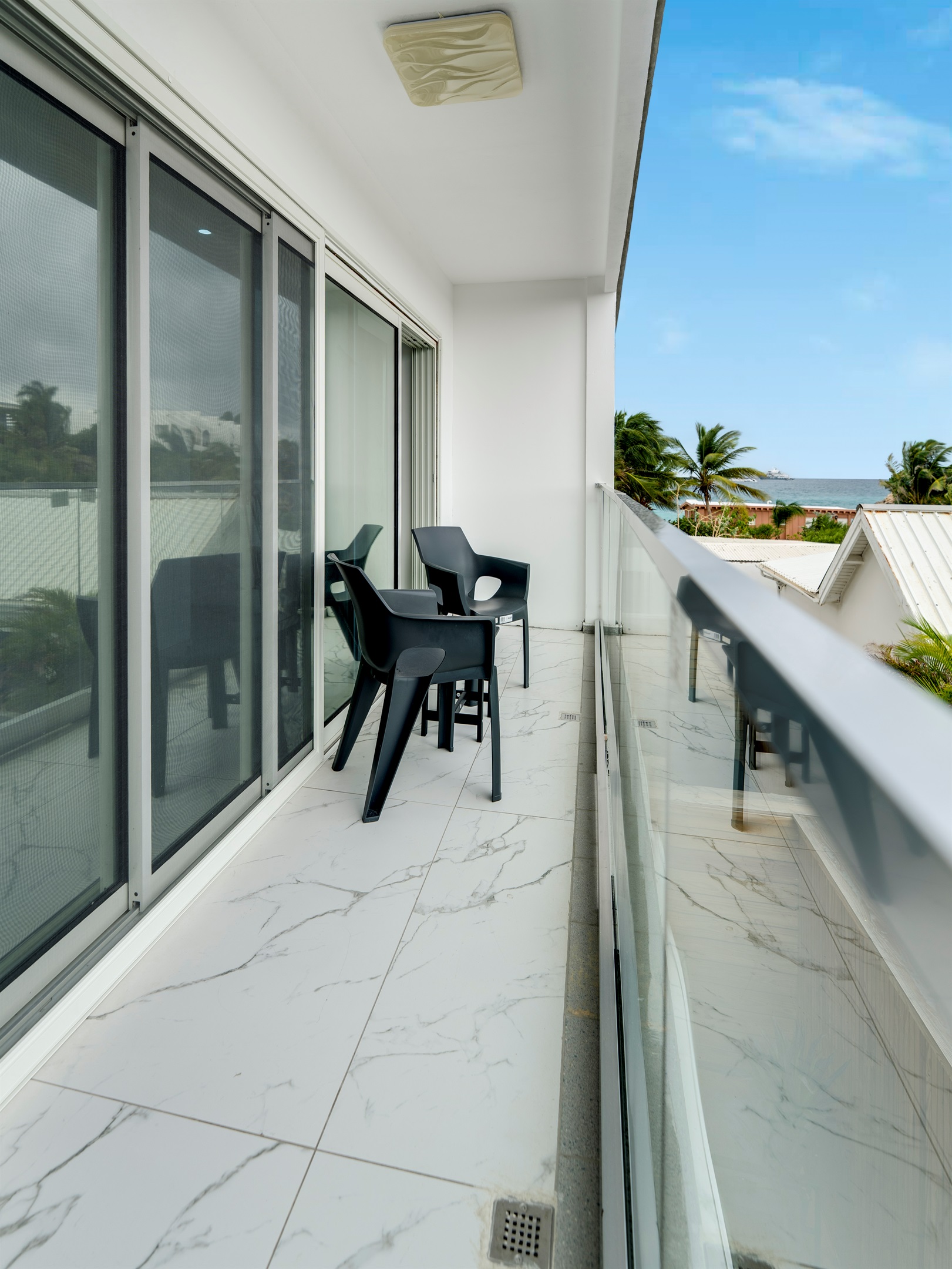 Private Balcony with Bistro Set & Lush Green Views