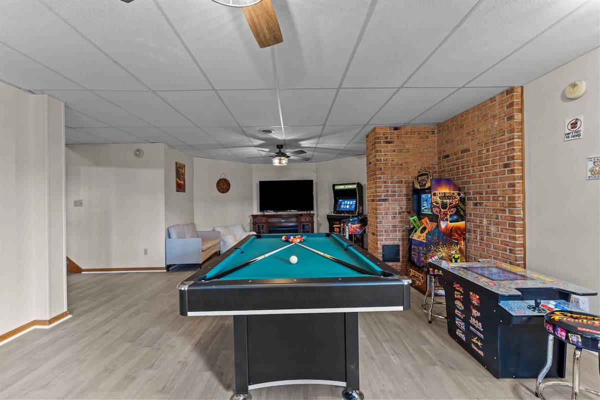 Game Room: Dive into fun with a billiard table, arcade games, and a cozy lounge area!