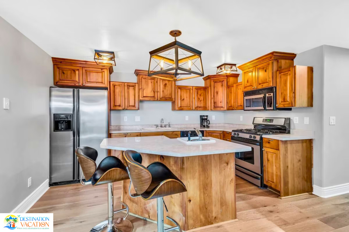 Warm wood cabinetry brings timeless mountain character.