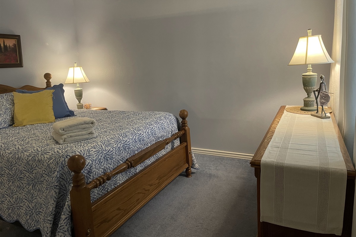 Unwind in this peaceful bedroom featuring a cozy bed, soothing tones, and a calm atmosphere—perfect for a restful night’s sleep.