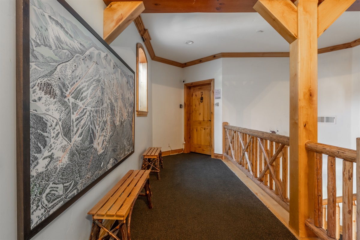 Upstairs foyer leads to Sonenalp 3, where you'll pass the large Mammoth Mountain trail map—perfect for planning your ski day.