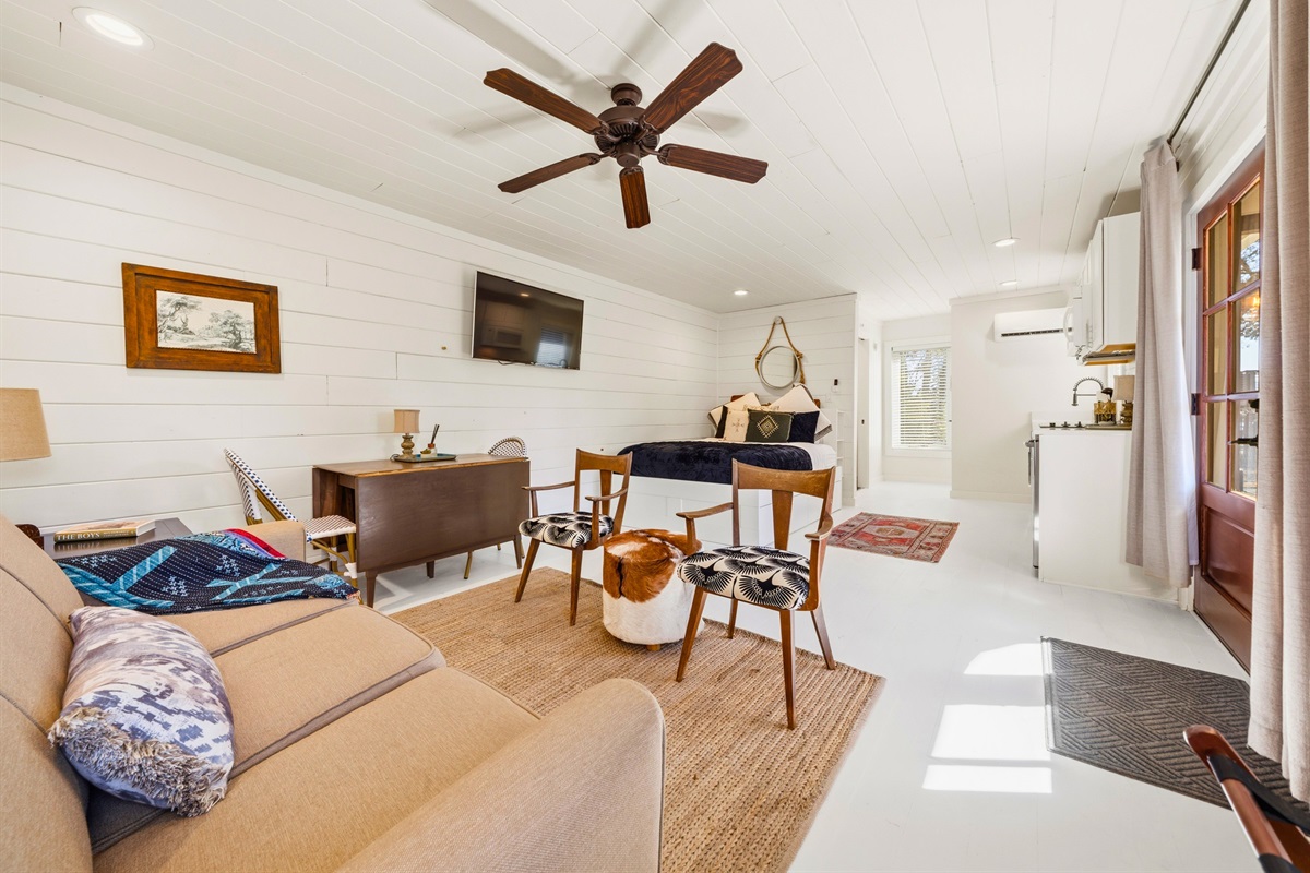 Step inside the cabin living space where warm tones, cozy seating, and natural light come together to create an inviting place to relax.