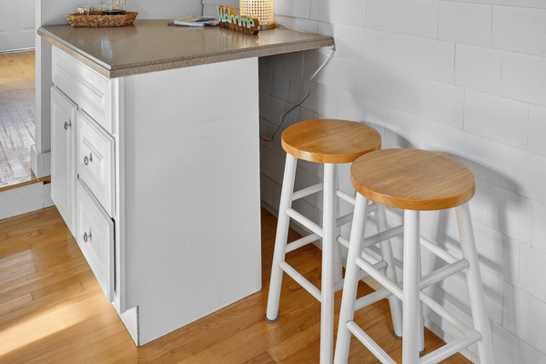Breakfast bar with seating for two—perfect for a quick bite, morning coffee, or keeping the chef company.