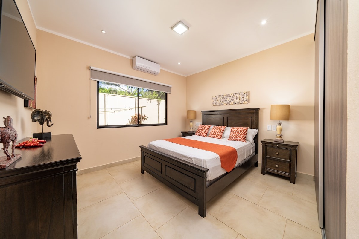 2nd bedroom equipped with a bed, smart TV and large closet space