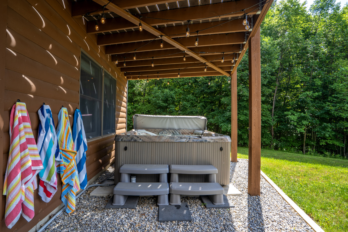 Relax in the private hot tub while taking in the peaceful mountain view. We also provide beach towels for your convenience!