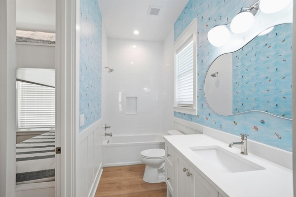 This bathroom is shared between the bunk room and the bedroom with 2 full beds.