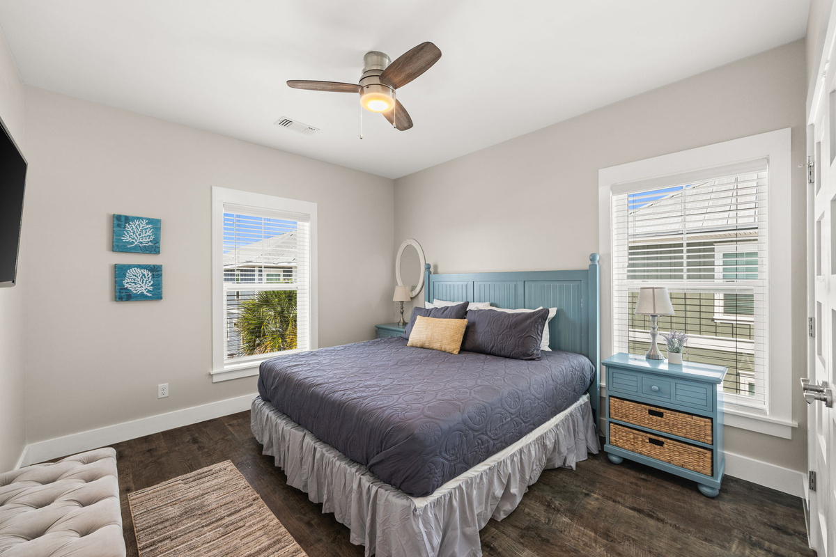 Spacious king guest bedroom with Smart TV — perfect setup for couples or families