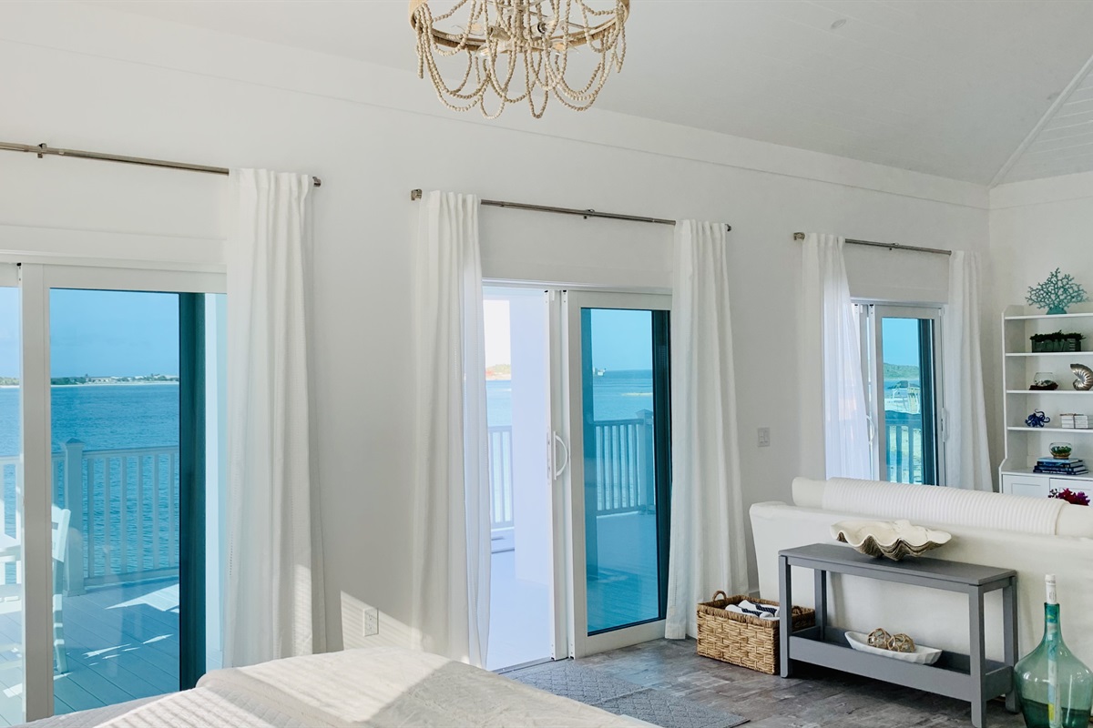 MERMAID COVE - Three double sliding doors lead to the outside covered patio with amazing views of the Sea Of Abaco, Montage Cay and Man O War Cay