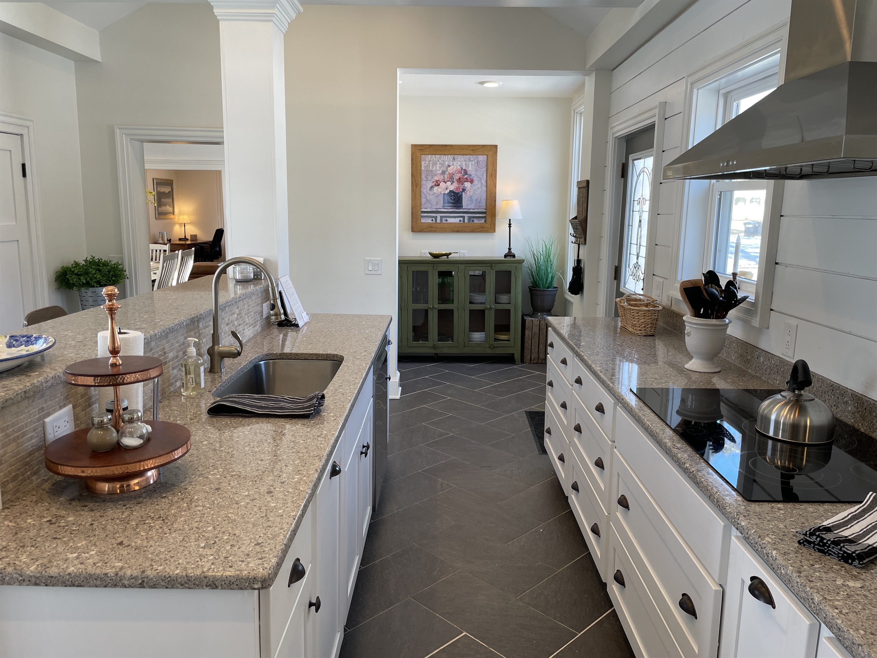 Convenient door to deck with outdoor grill at end of counter