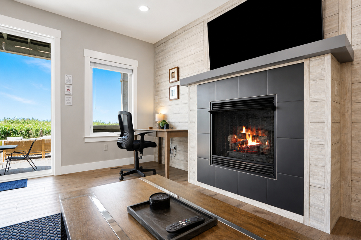 Designed with comfort in mind, this stylish living area offers a warm, welcoming atmosphere for the whole group. Unwind by the fireplace, enjoy quality time together, or simply soak in the peaceful coastal ambiance.