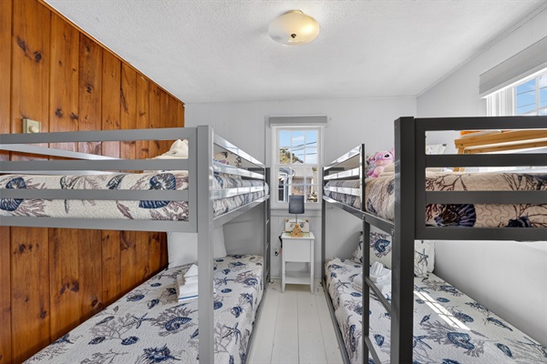 Welcome to our second bedroom with two sets of twin bunk beds! Perfect for shared adventures and sweet dreams!