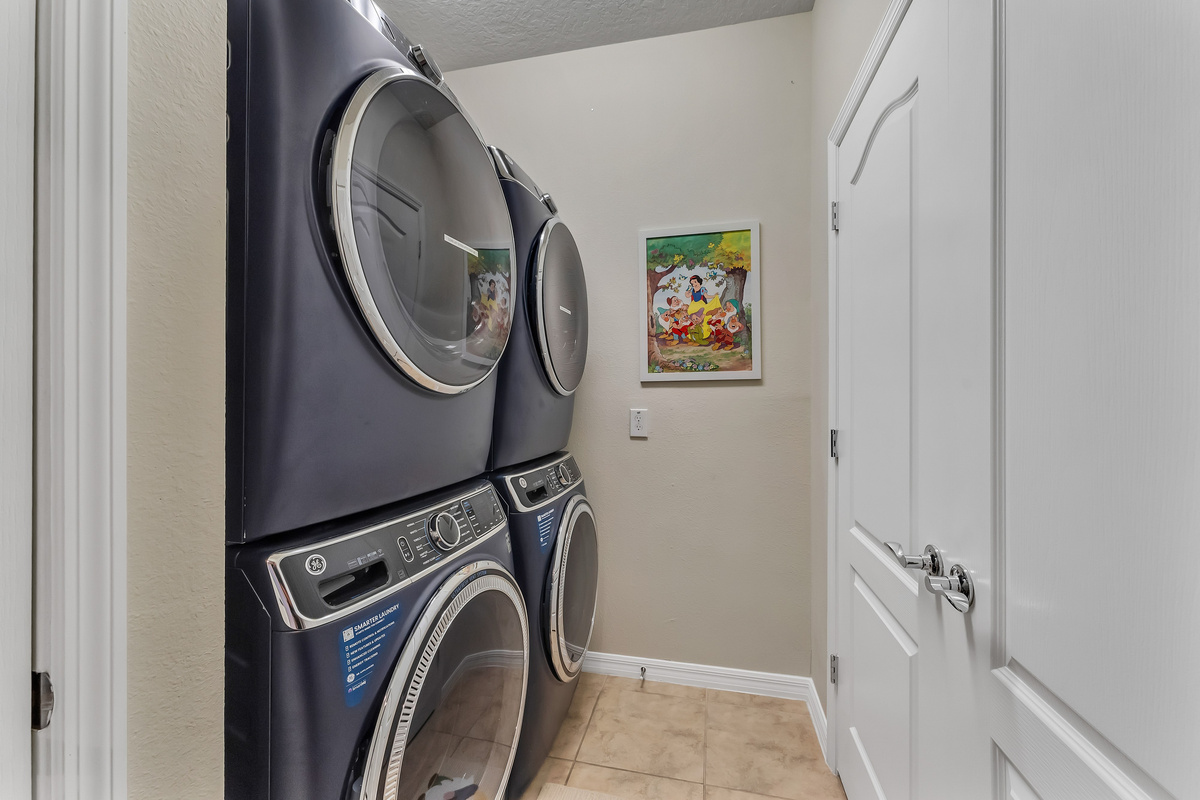 2 washing machines and 2 dryers in laundry room