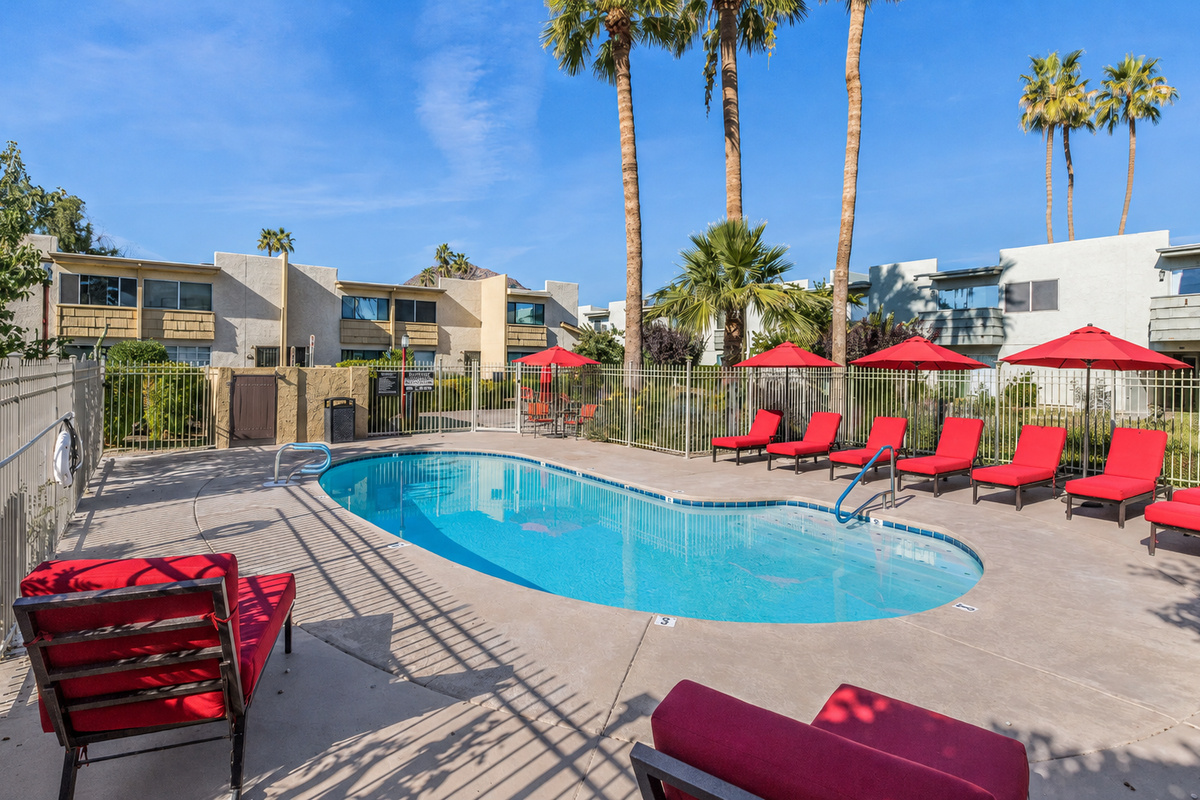 Shared community pool with lounge seating