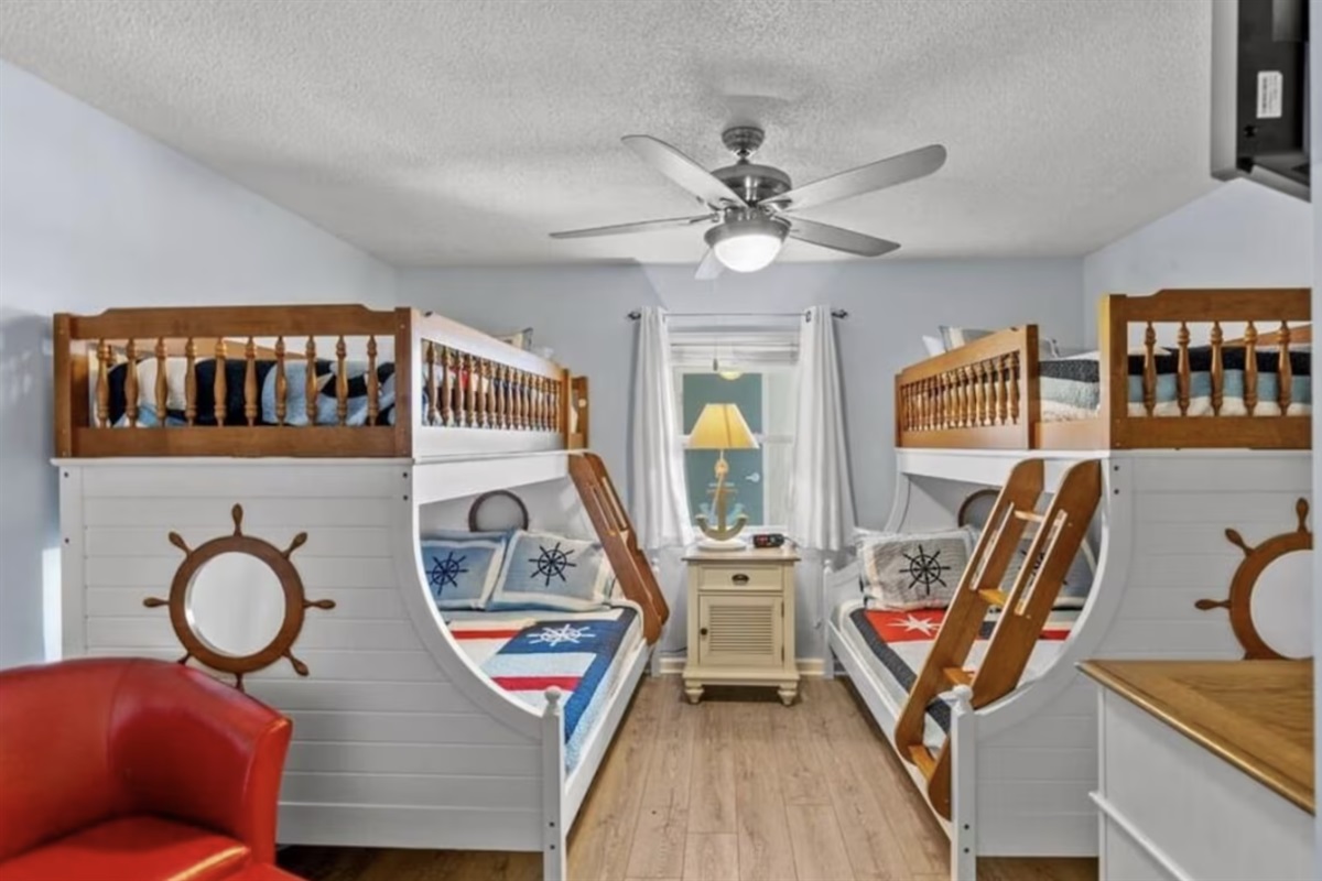 The nautical-themed bunkbed room can sleep as many as 6 people! 2 full beds and 2 singles.