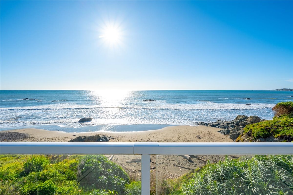 View off deck of secluded beach cove