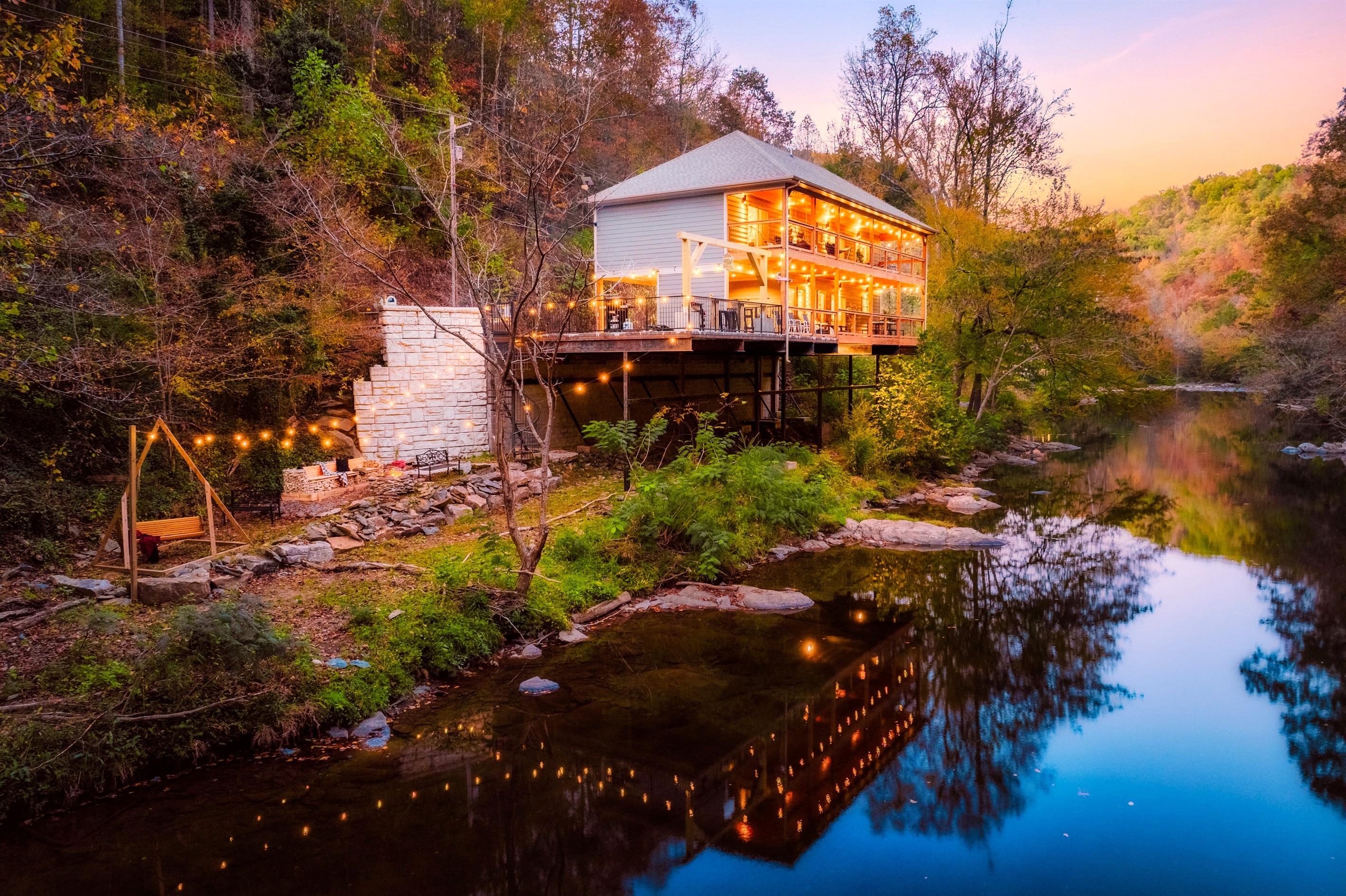 Perched right above the famous "Little Pigeon River" in Gatlinburg, TN. Welcome to "Take Me to the River Cabin"