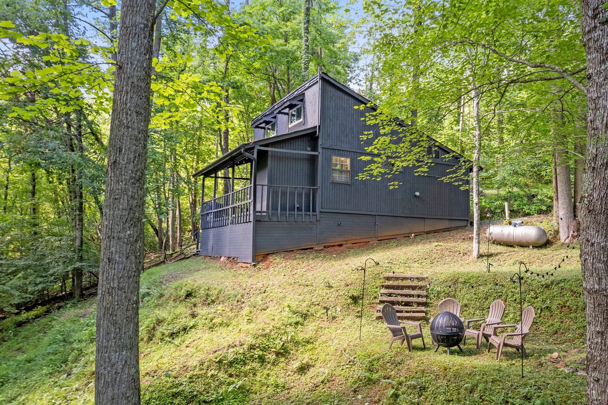 Side view of property and fire pit area 