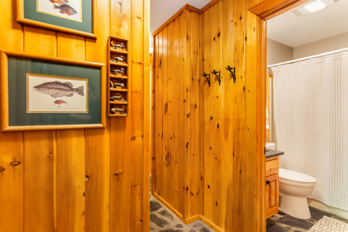 Hallway that leads to full bathroom